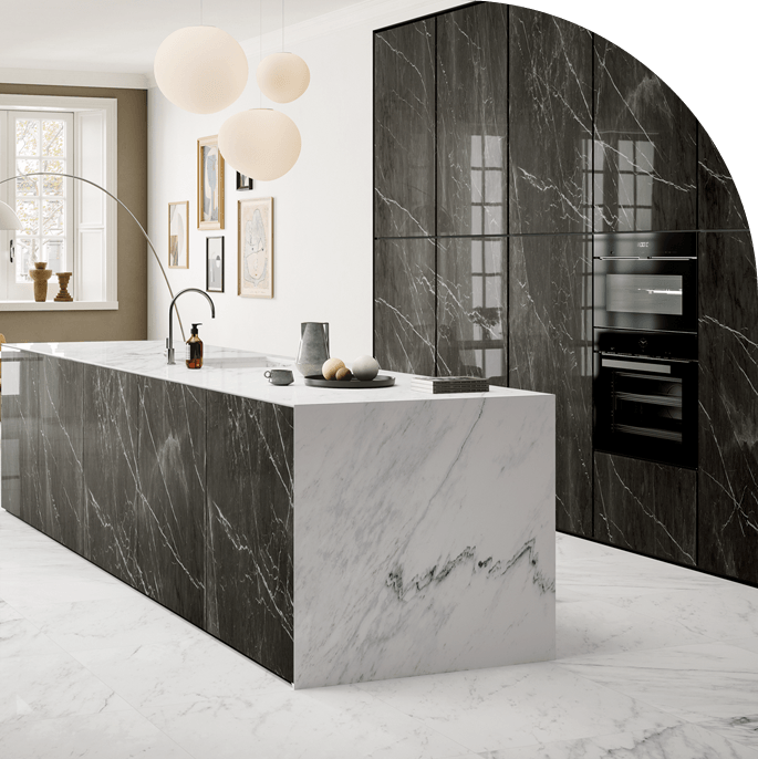 A marble tiled kitchen with a minimalist island and modern lights