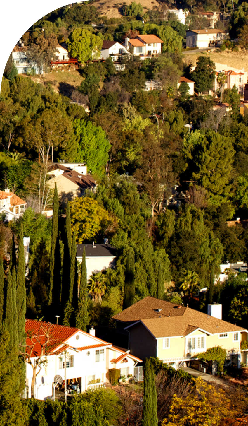 A view of Woodland Hills Houses during sunset