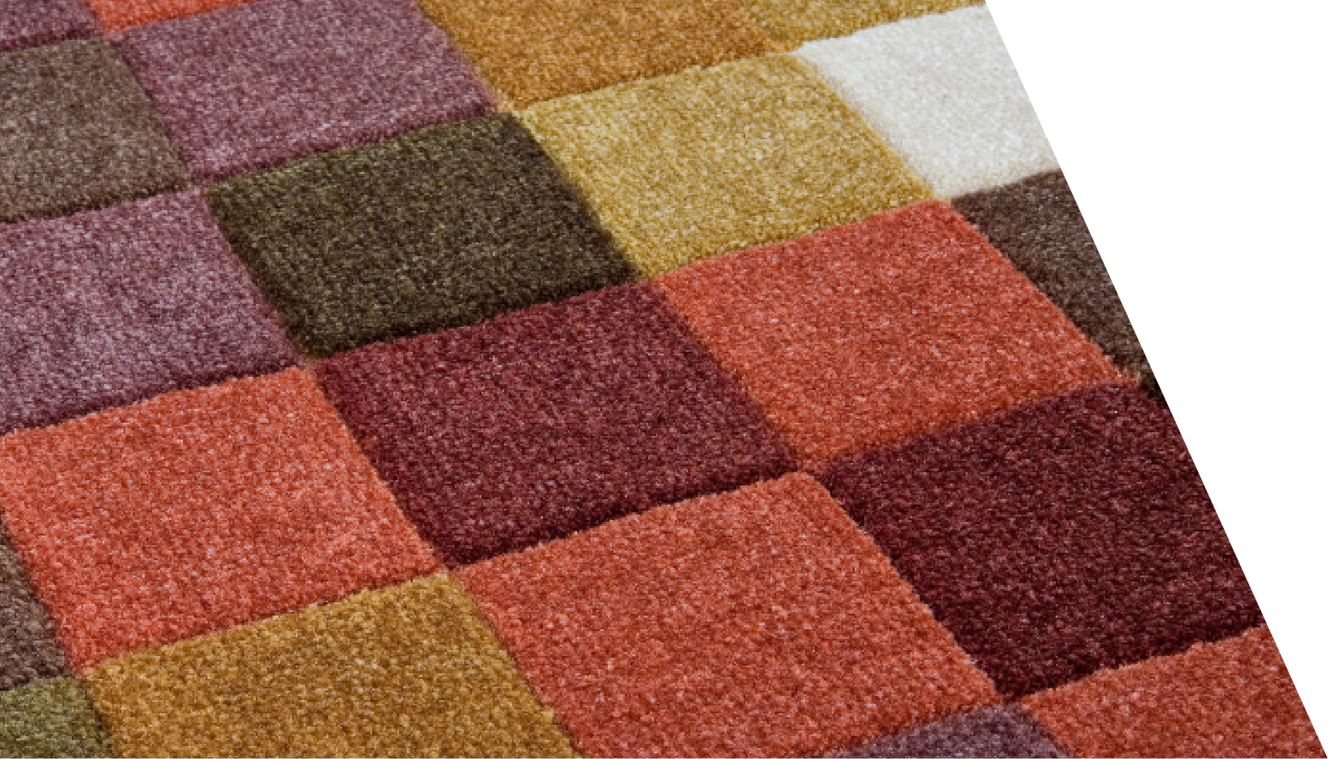 A close up of a colorful checkered carpet on a white background.