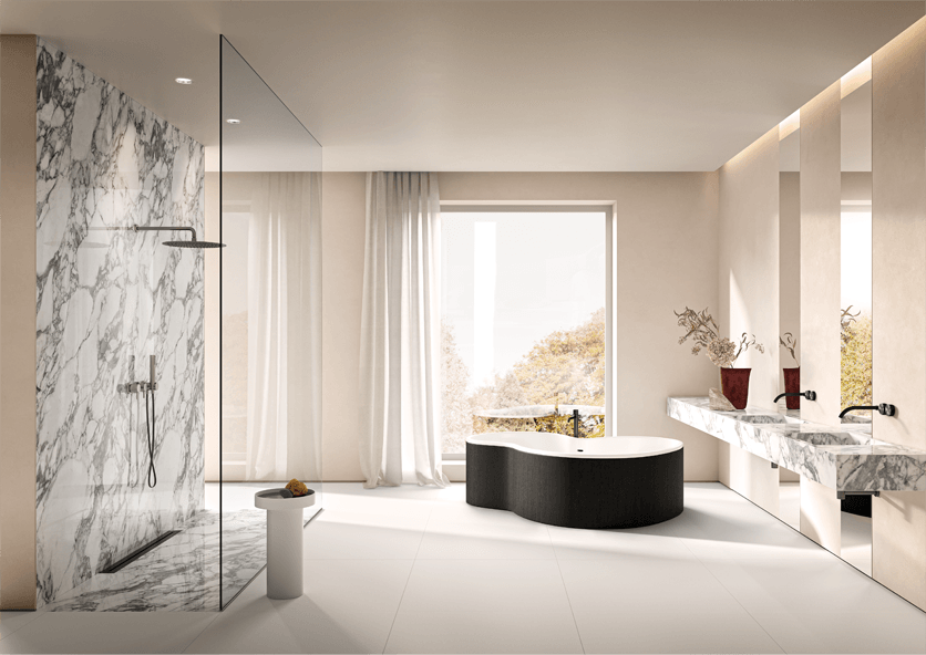 Luxury white floor tiles in a light bathroom with a black tub and marble details