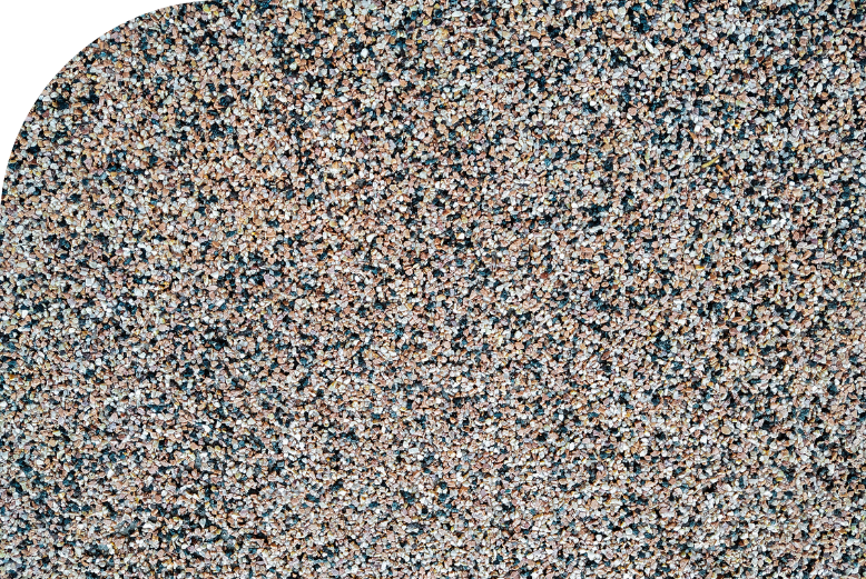 A close up image of a gravel background with quartz-filled epoxy flooring.