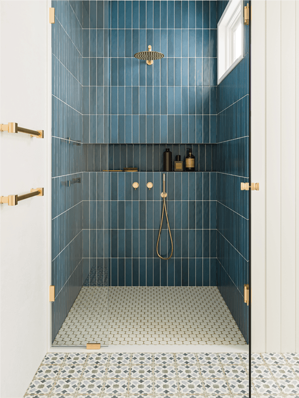 Rich blue bathroom wall tiles with gold hardware