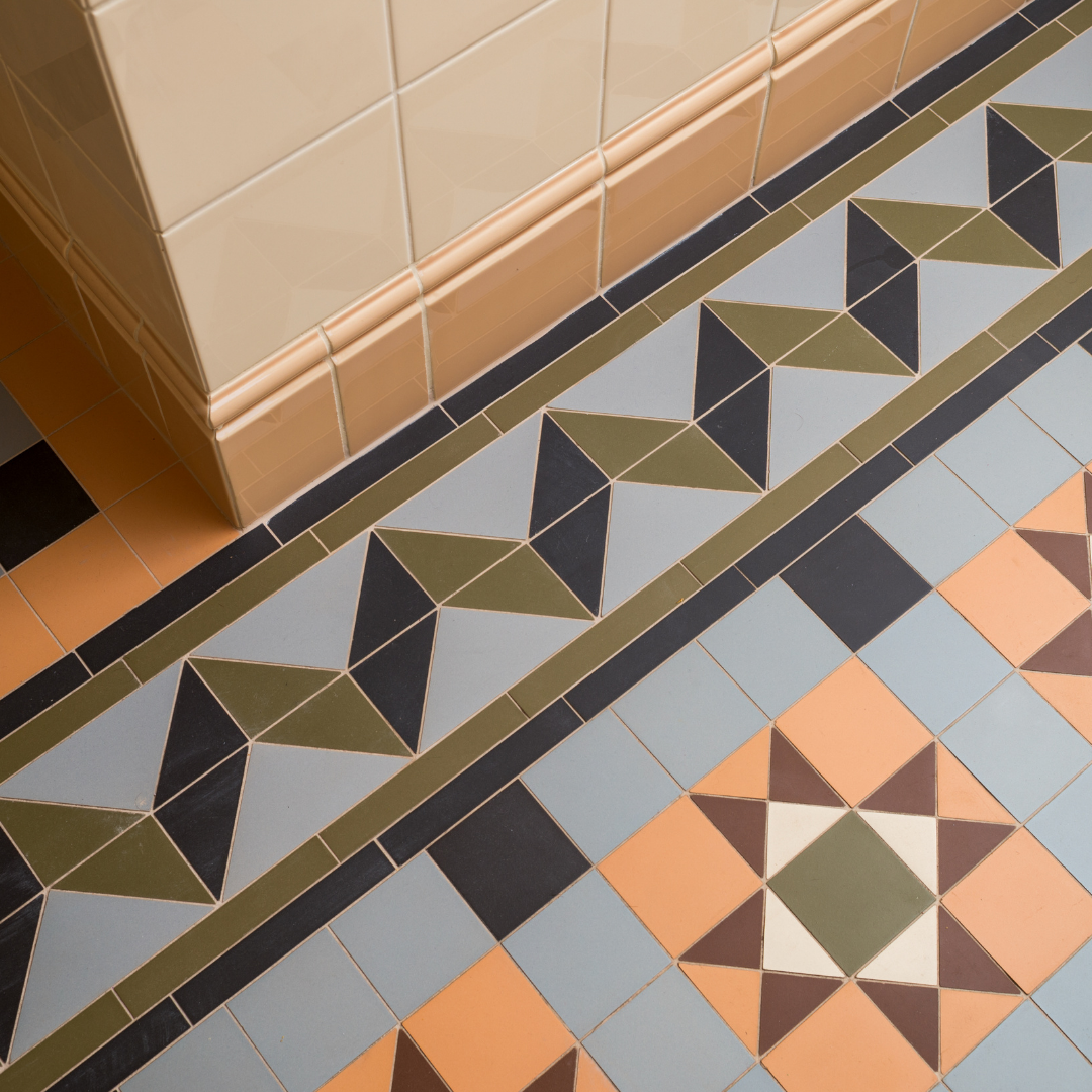 A tiled floor with a geometric pattern on it