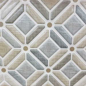 A close up of a tile with a geometric pattern on it.