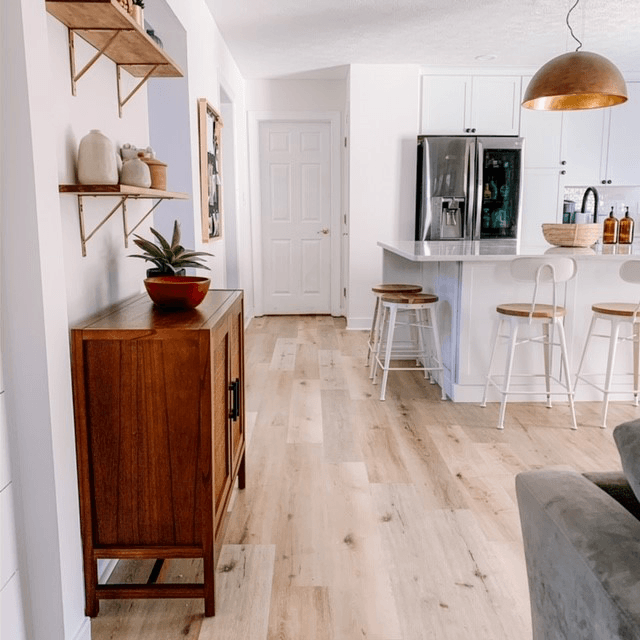 White kitchen with wood textured laminate floors
