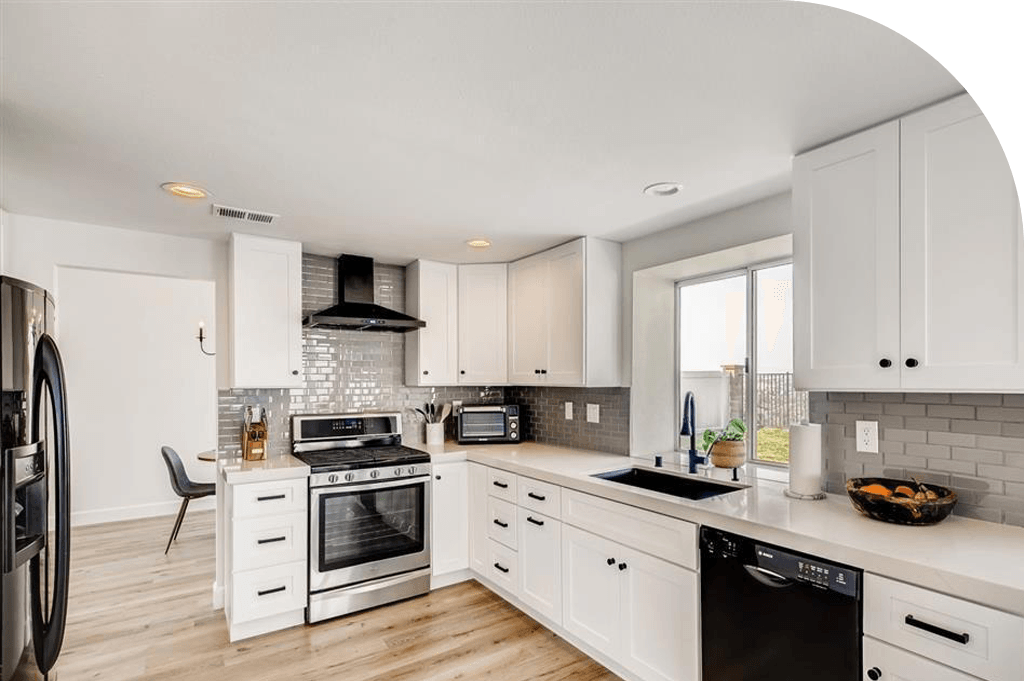 clean white themed kitchen with luxury vinyl flooring