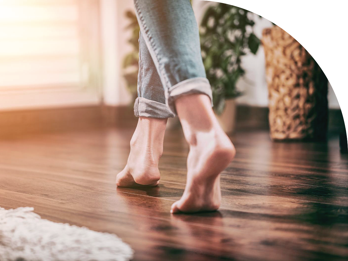 woman's barefoot on the vinyl flooring