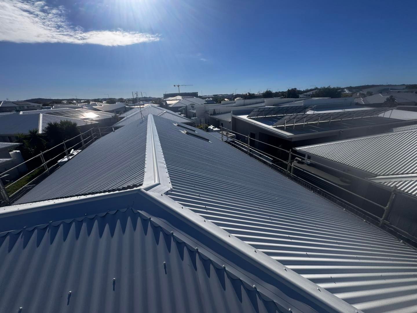 Metal Roof With Safety Railings, Sunny Day — Venom Roofing Pty Ltd in Sunshine Coast, QLD