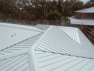 White Metal Roof With a Complex Structure, Visible Guardrails — Venom Roofing Pty Ltd in Sunshine Coast, QLD