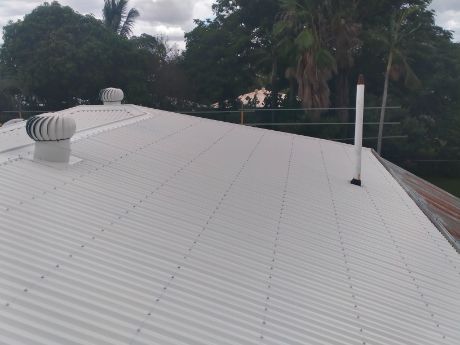 White Corrugated Metal Roof With Vents, Trees in Background — Venom Roofing Pty Ltd in Sunshine Coast, QLD