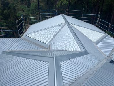 Metal Roof With Triangular Skylights; Scaffolding in Background — Venom Roofing Pty Ltd in Sunshine Coast, QLD