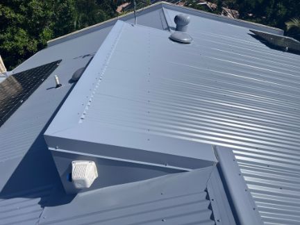 Blue Metal Roof With Vent and Solar Panels — Venom Roofing Pty Ltd in Sunshine Coast, QLD