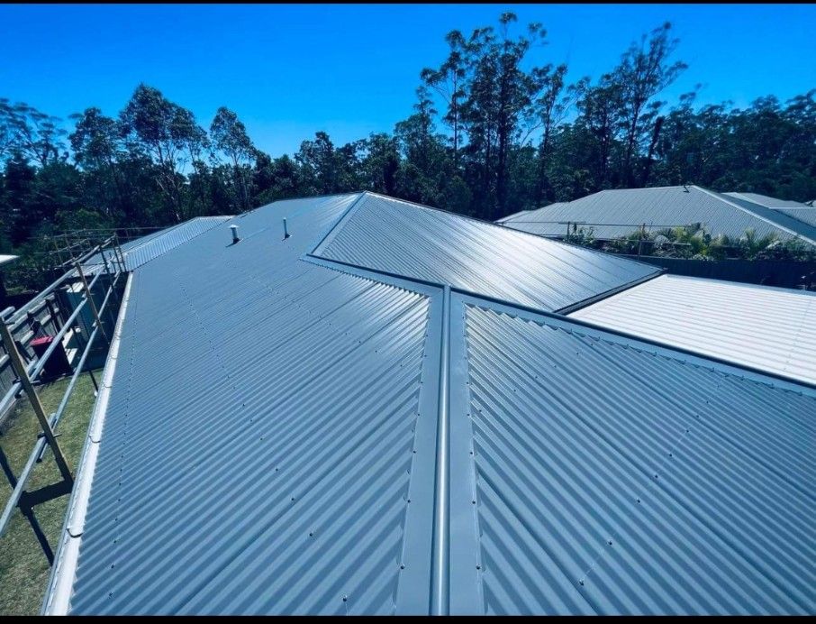 View of a Newly Installed Corrugated Metal Roof on a House — Venom Roofing Pty Ltd in Sunshine Coast, QLD