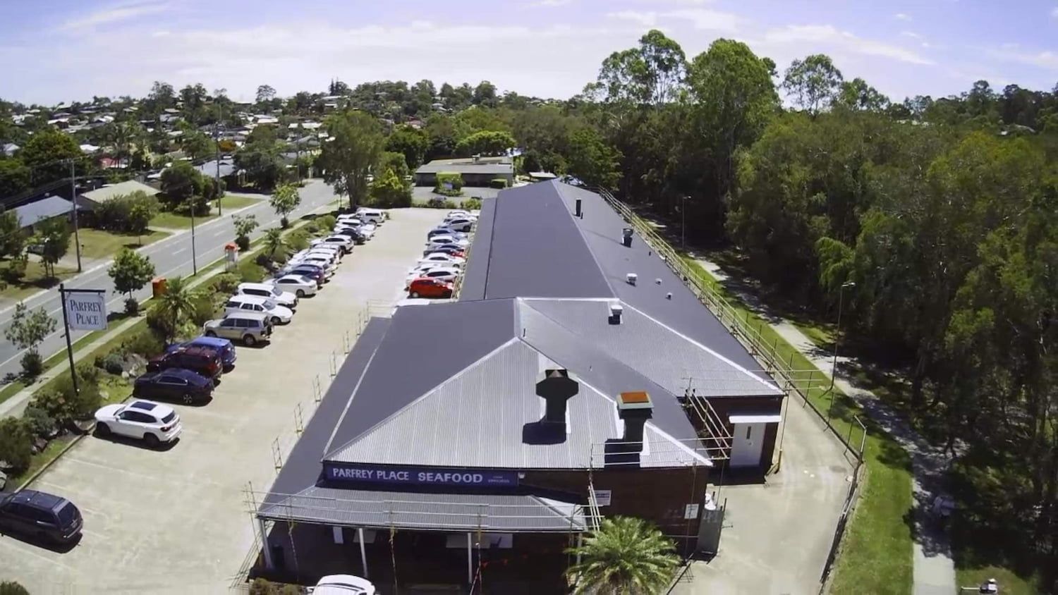 Aerial View of the Bargo Hotel in Bargo, Australia, With a Car Park and Trees — Venom Roofing Pty Ltd in Sunshine Coast, QLD