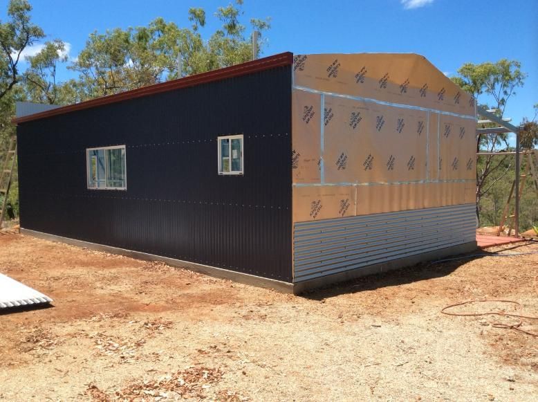 Building in Progress: Half-finished Black Corrugated Metal Shed — Bridgey's Constructions in Wallabi Point, NSW