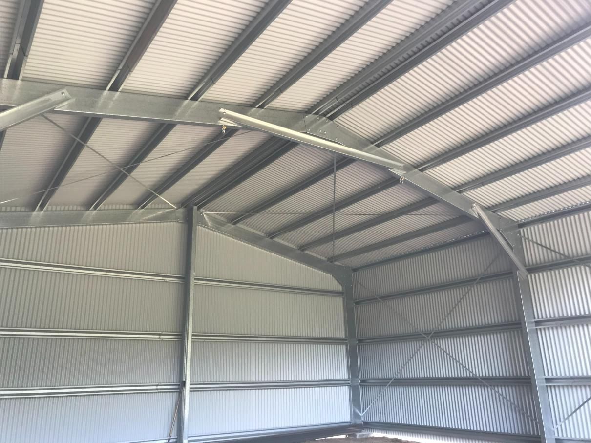 Interior View of a Metal Shed With a Curved Roof — Bridgey's Constructions in Wallabi Point, NSW
