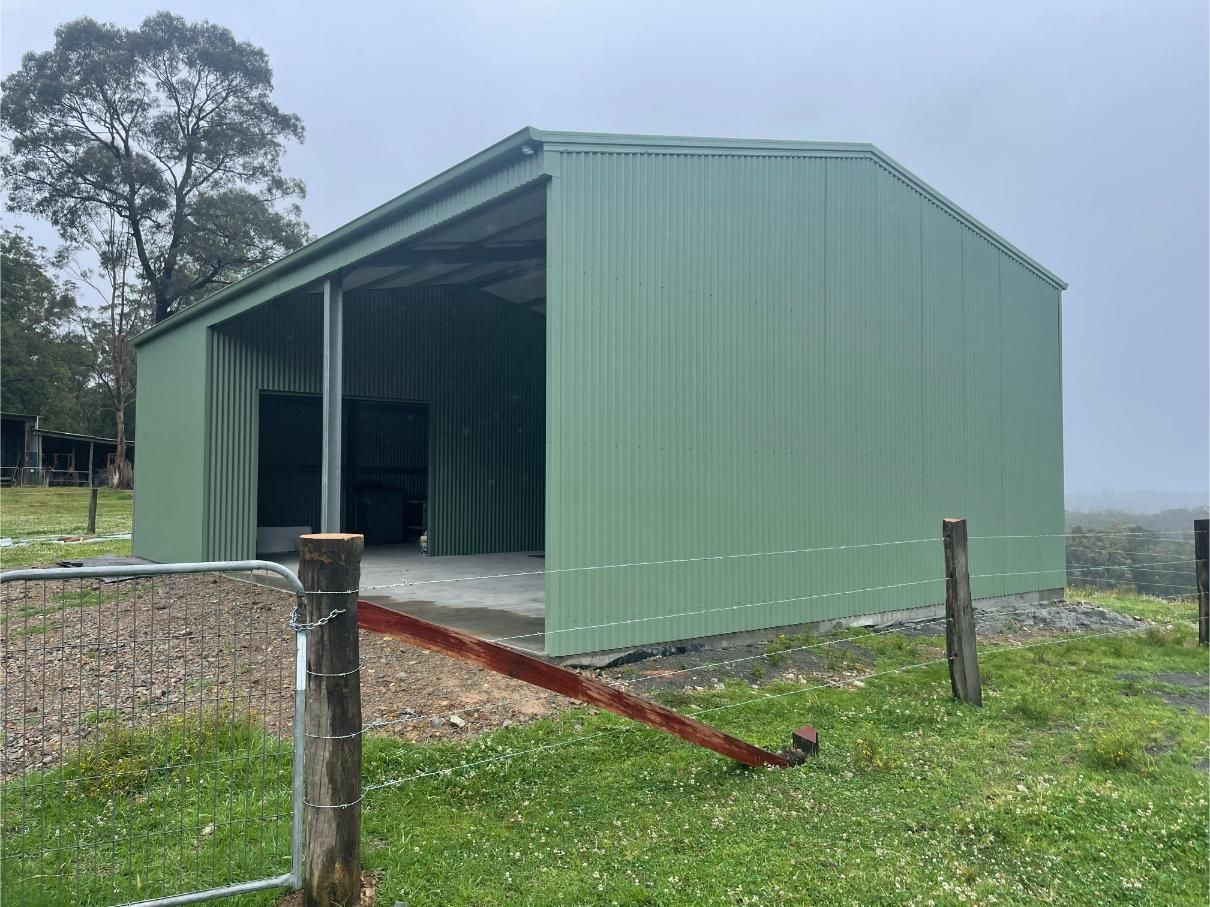 Green Metal Shed With an Open Side — Bridgey's Constructions in Nowendoc, NSW