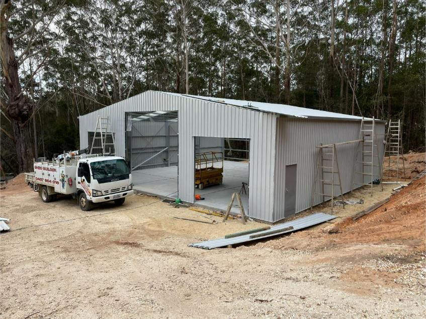 A Newly Constructed Metal Garage With Open Bays — Bridgey's Constructions in Bulahdelah, NSW