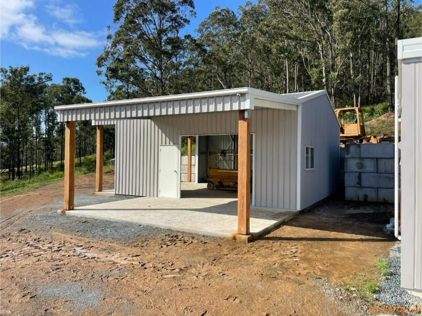 A Small Gray Building With an Open-air Carport — Bridgey's Constructions in Old Bar, NSW