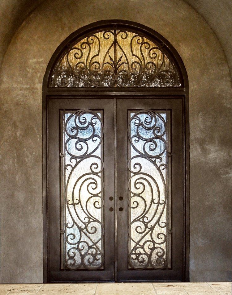 A door with a wrought iron design on it
