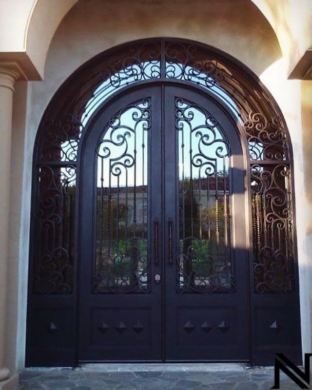A wrought iron door with the letter n on it