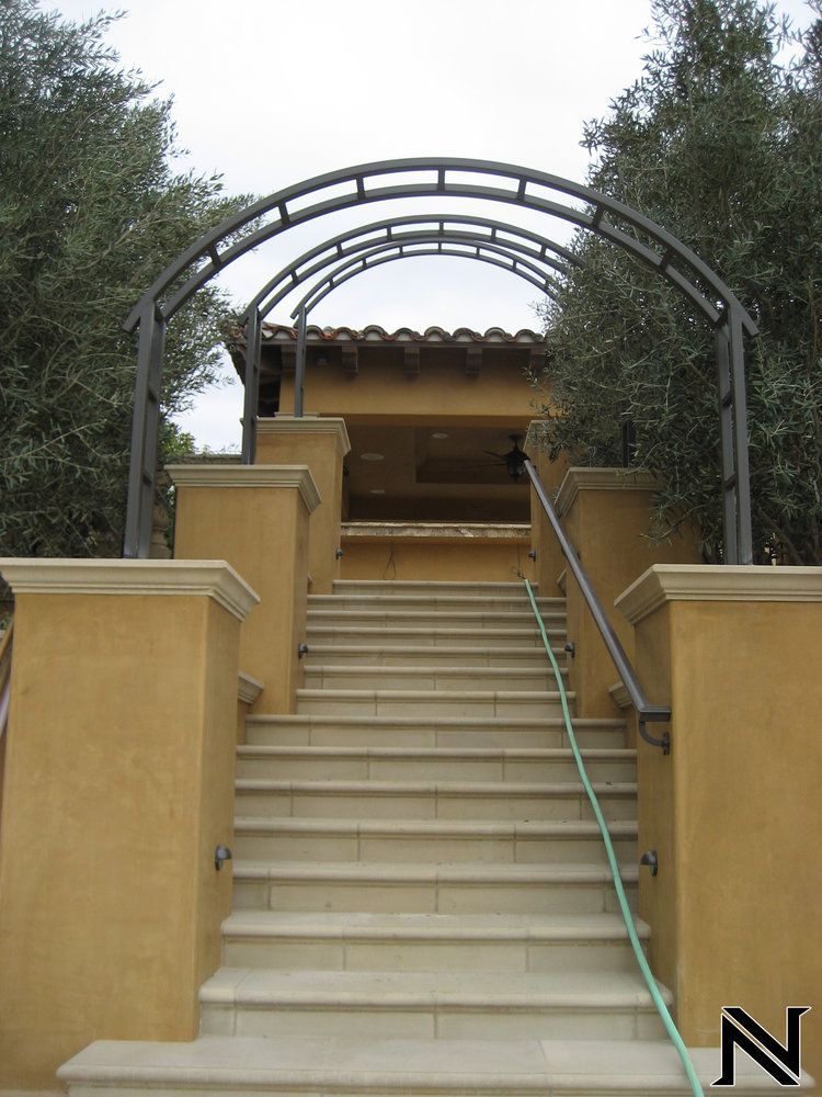 Stairs leading up to a building with the letter n on the bottom
