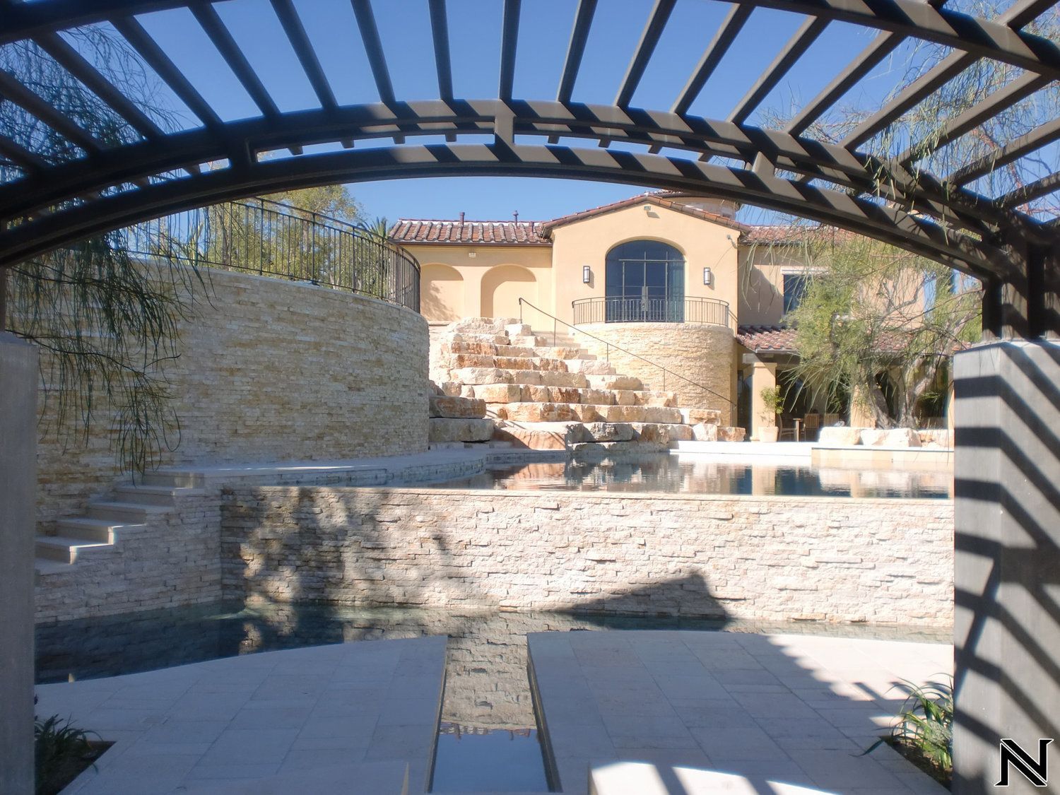 A large house with stairs leading up to it