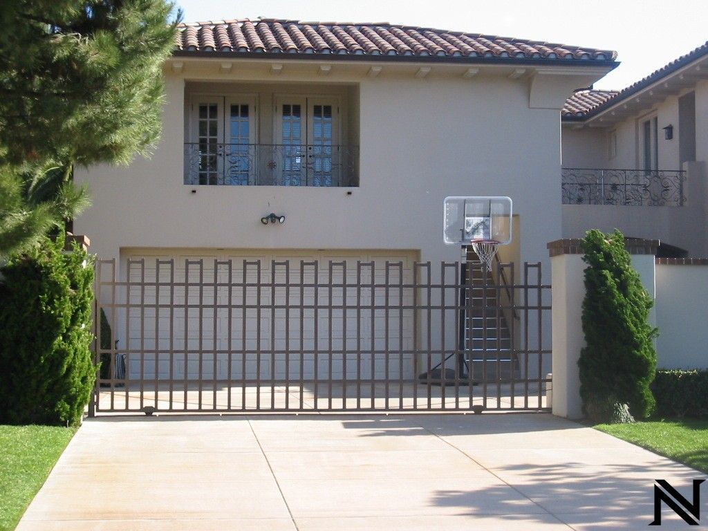 A white house with a basketball hoop in front of it
