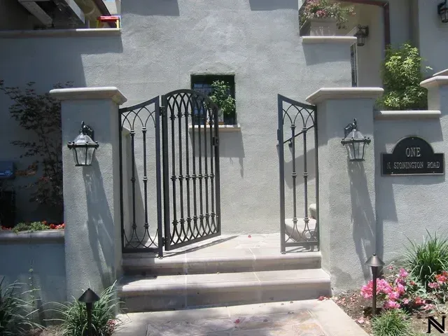 A staircase with a wrought iron railing in a living room