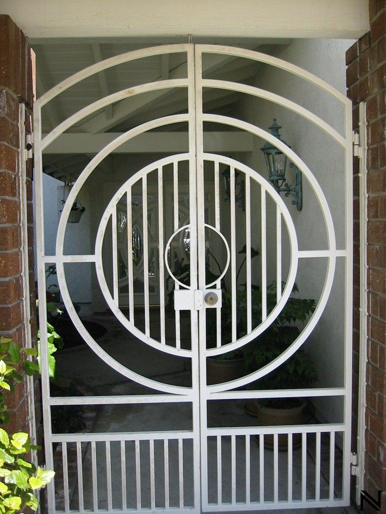 A white gate with a circular design on it