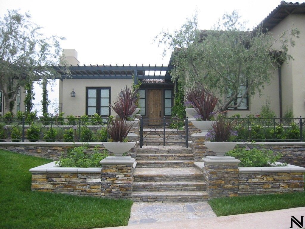 A house with a stone walkway leading to the front door