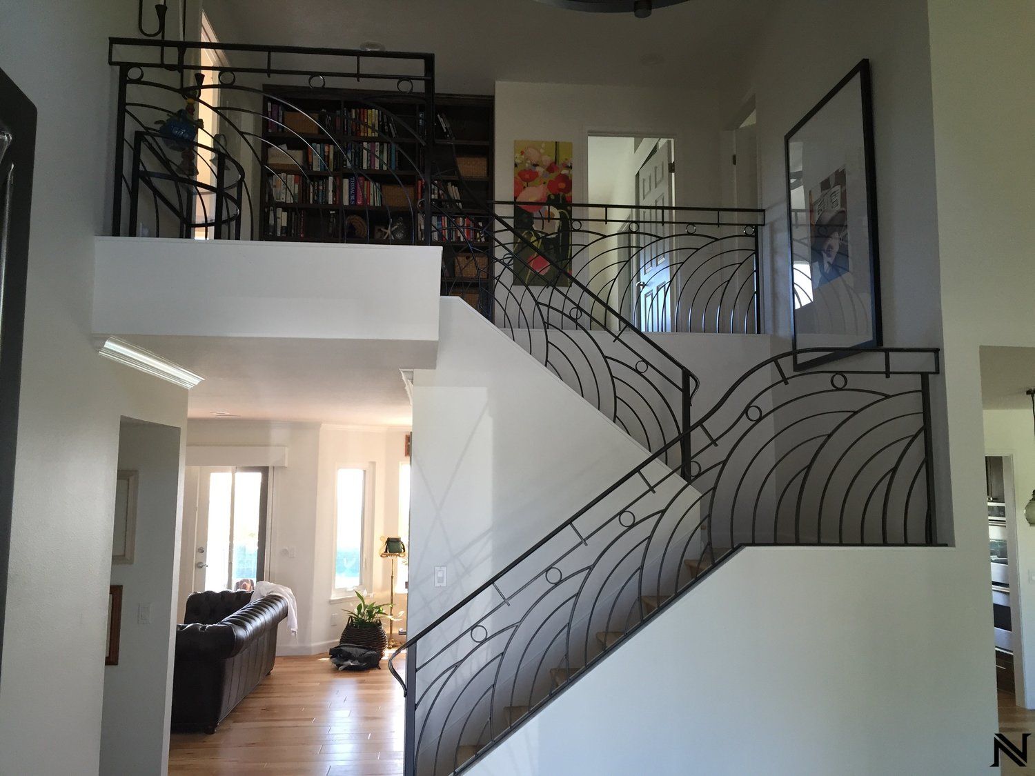A staircase with a wrought iron railing in a house