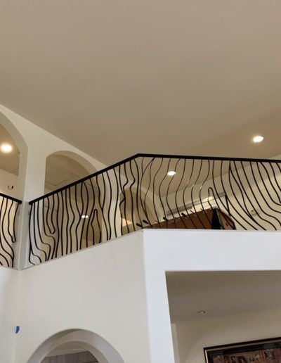 A balcony with a railing that looks like a zebra print