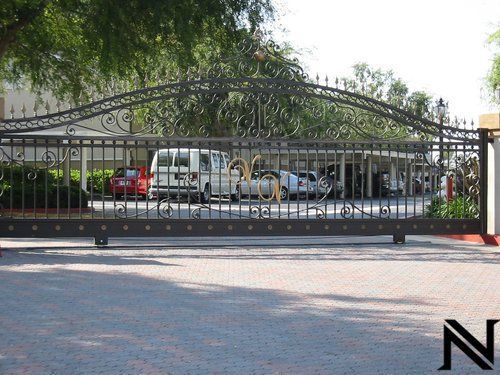 A sliding gate with the letter n on it