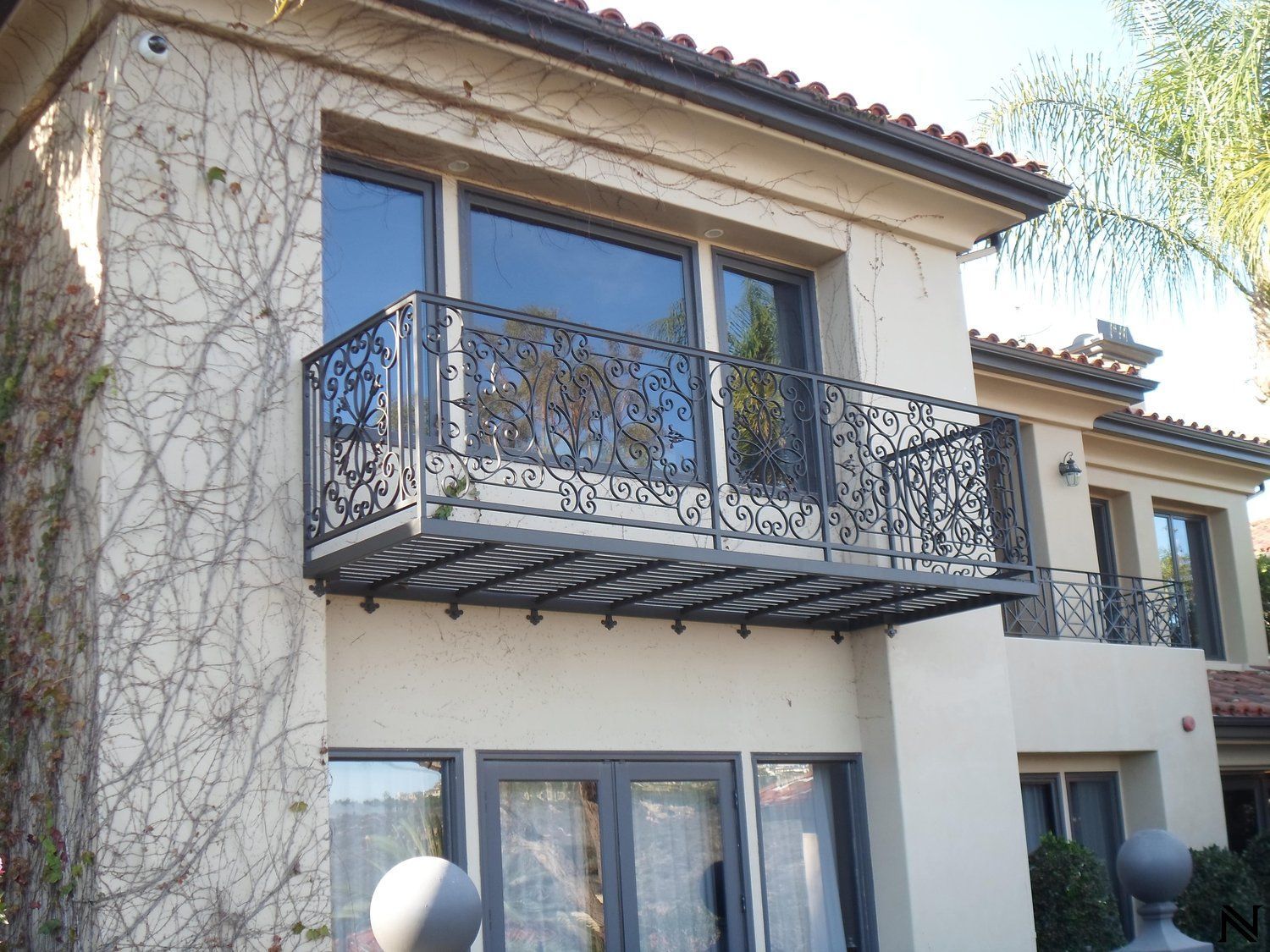 A large house with a balcony on the second floor