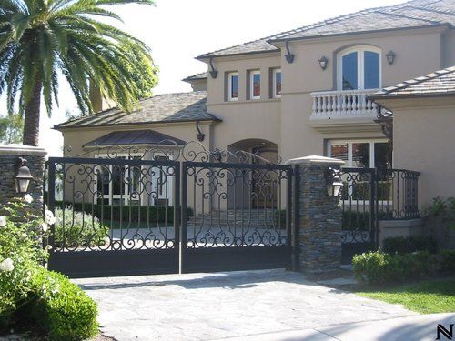A large house with a palm tree in front of it