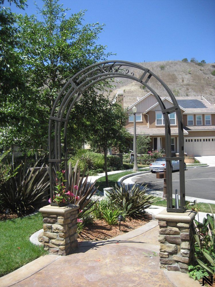 A house with a large arch in front of it