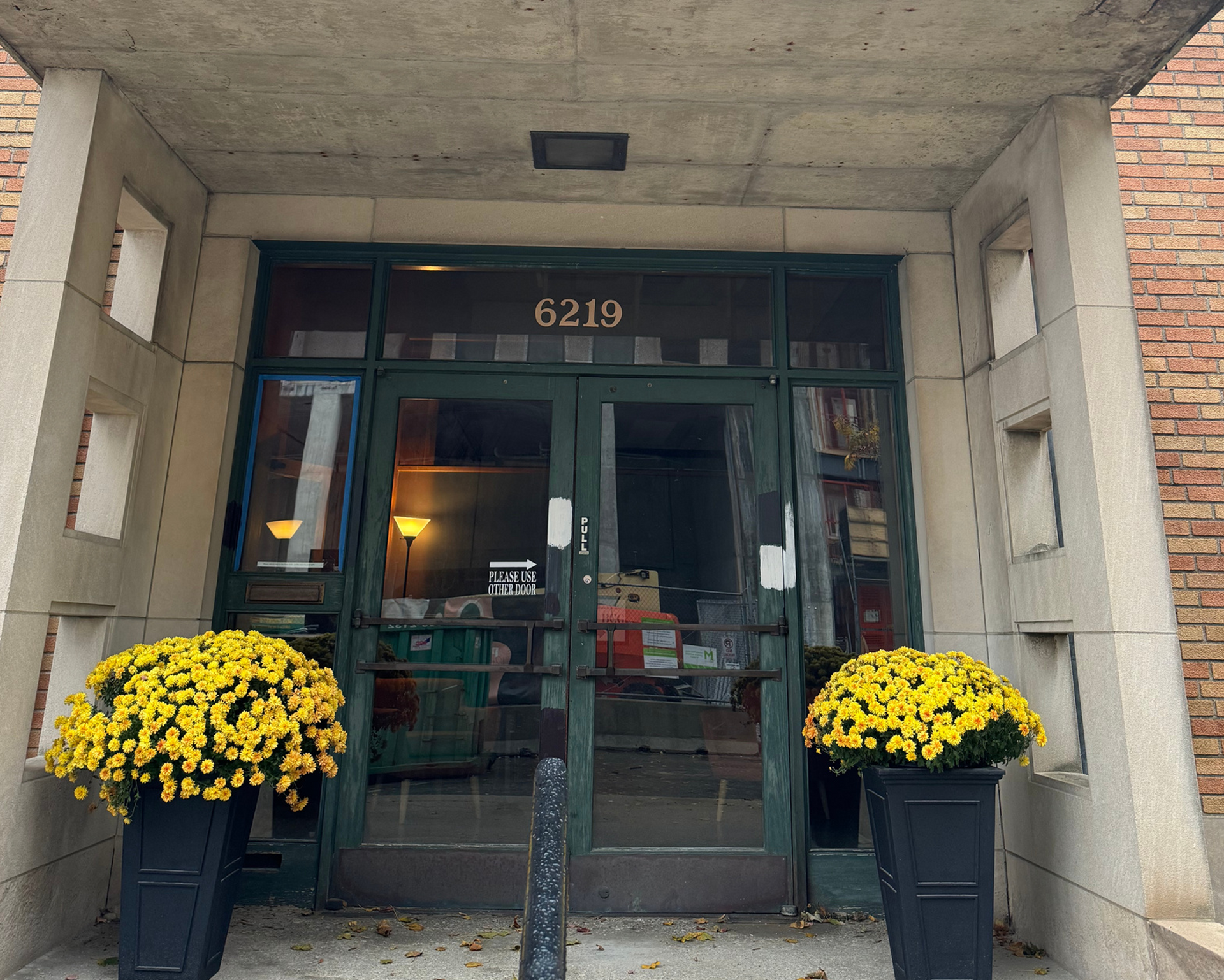 A brick building with a patio in front of it A brick building with a patio in front of it