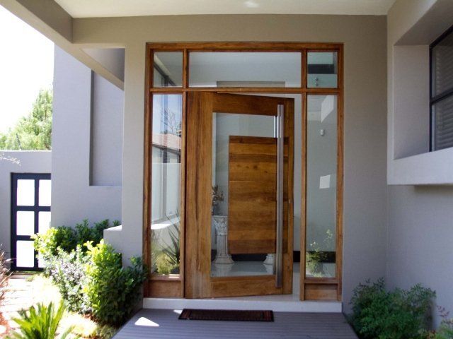 Grapedoor Custom made glass door with large wood and steel handle detail