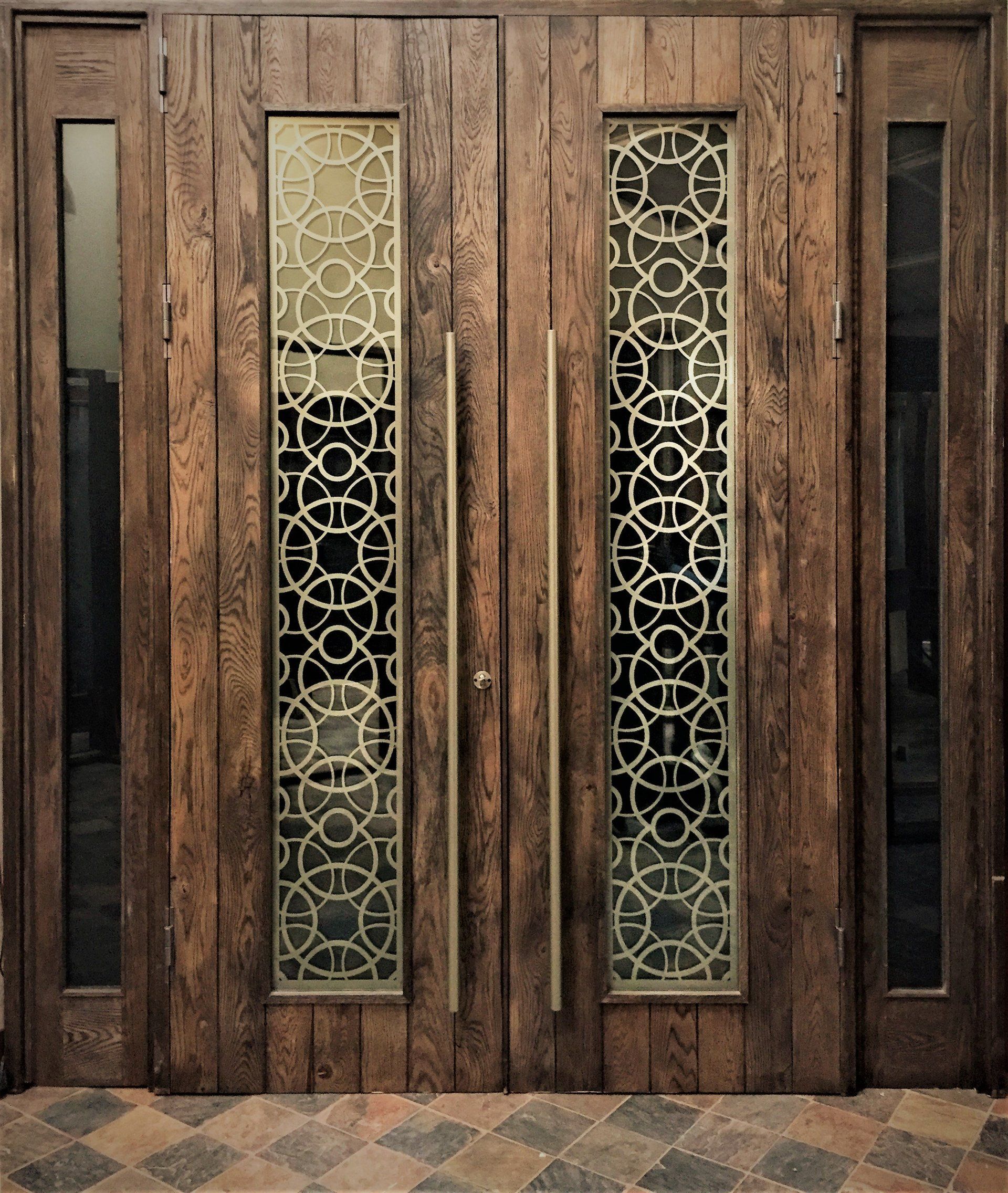 Grapedoor Custom made glass door with decorative steel rounded