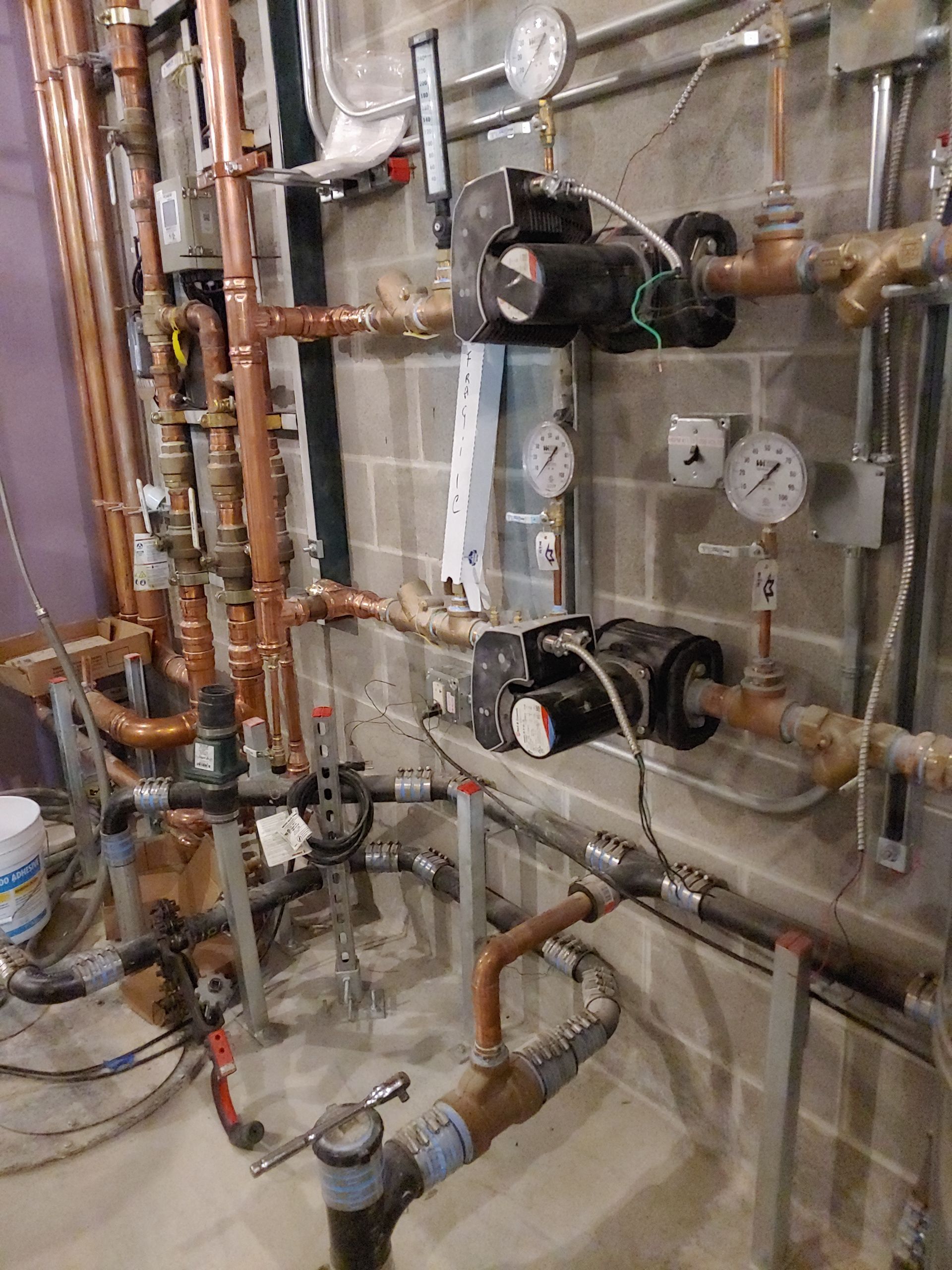 A room filled with lots of pipes and gauges.