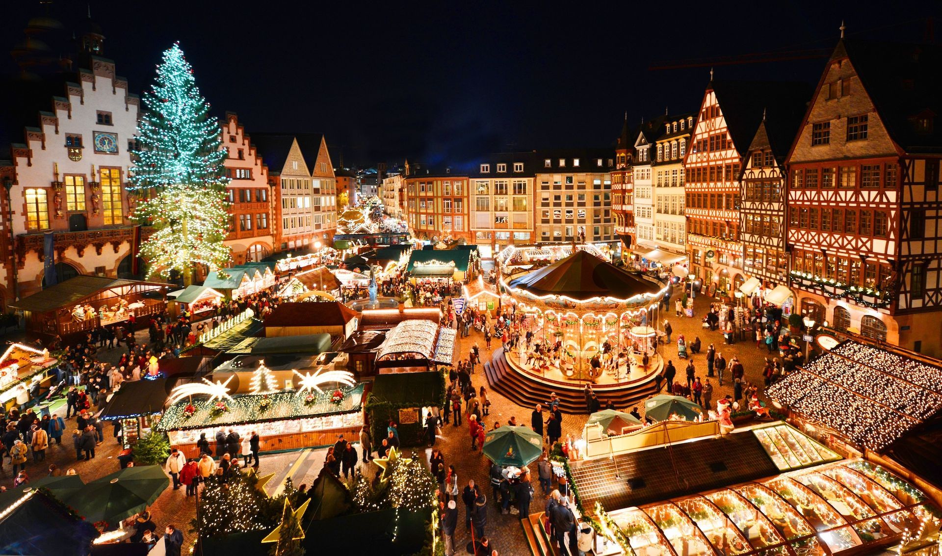 An aerial view of a christmas market at night