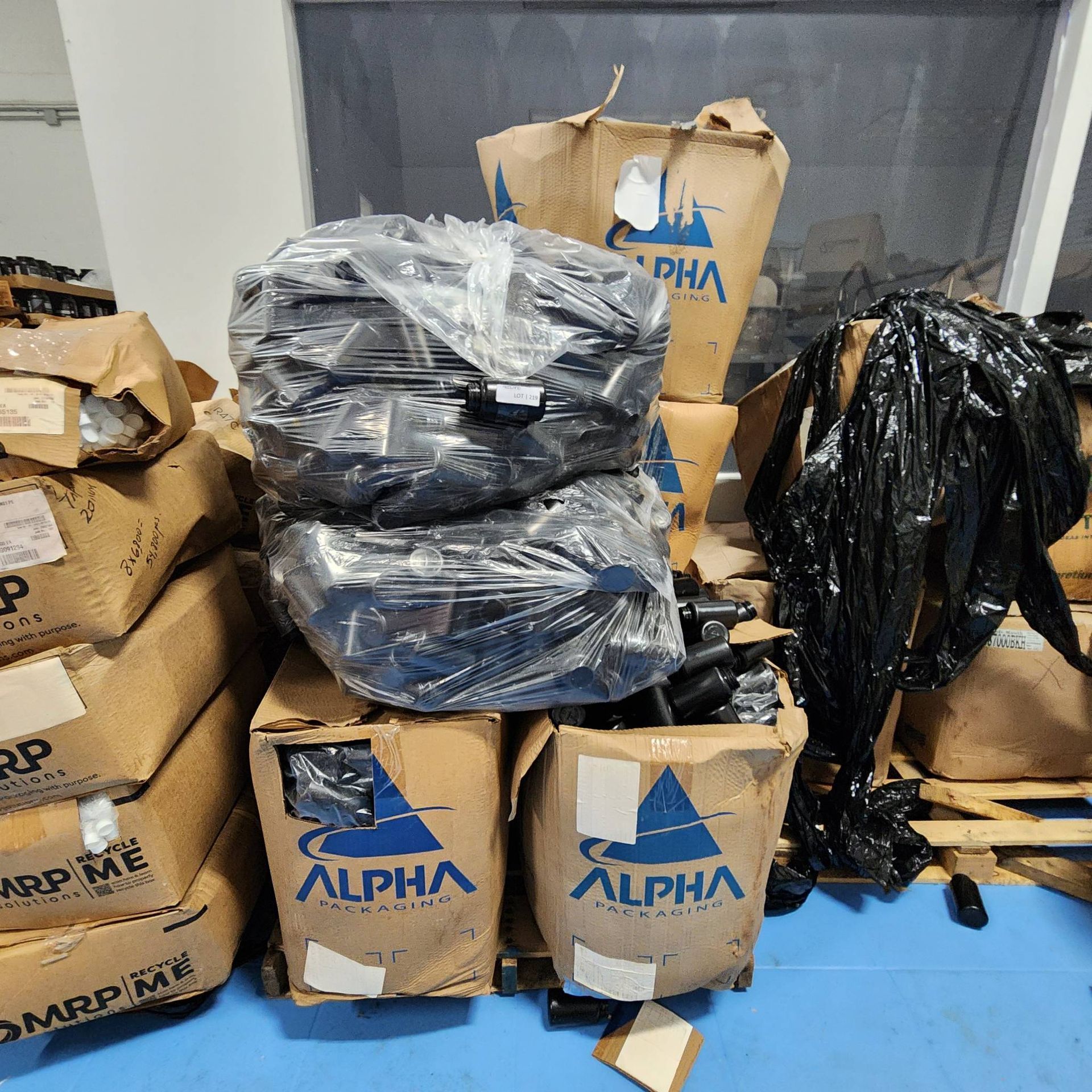 Lot 219 - Bulk Lot of Black Plastic Bottles