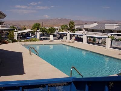 A large swimming pool with mountains in the background