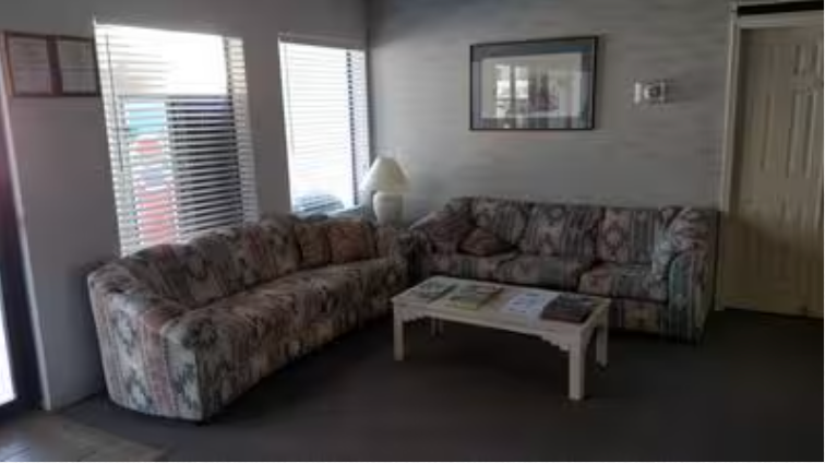 A living room with two couches and a coffee table.