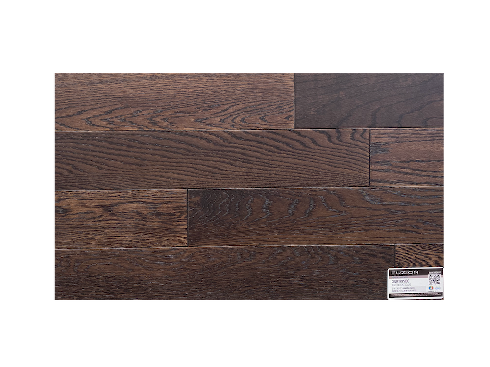 A close up of a piece of hardwood flooring on a white background.
