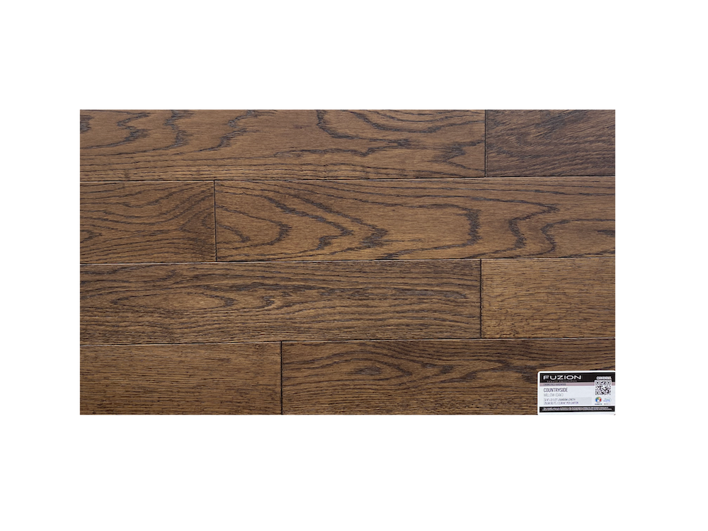 A close up of a piece of hardwood flooring on a white background.