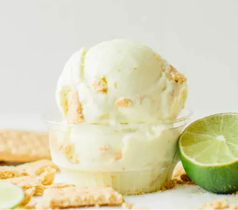 Small frozen key lime custard sunday with graham crackers.