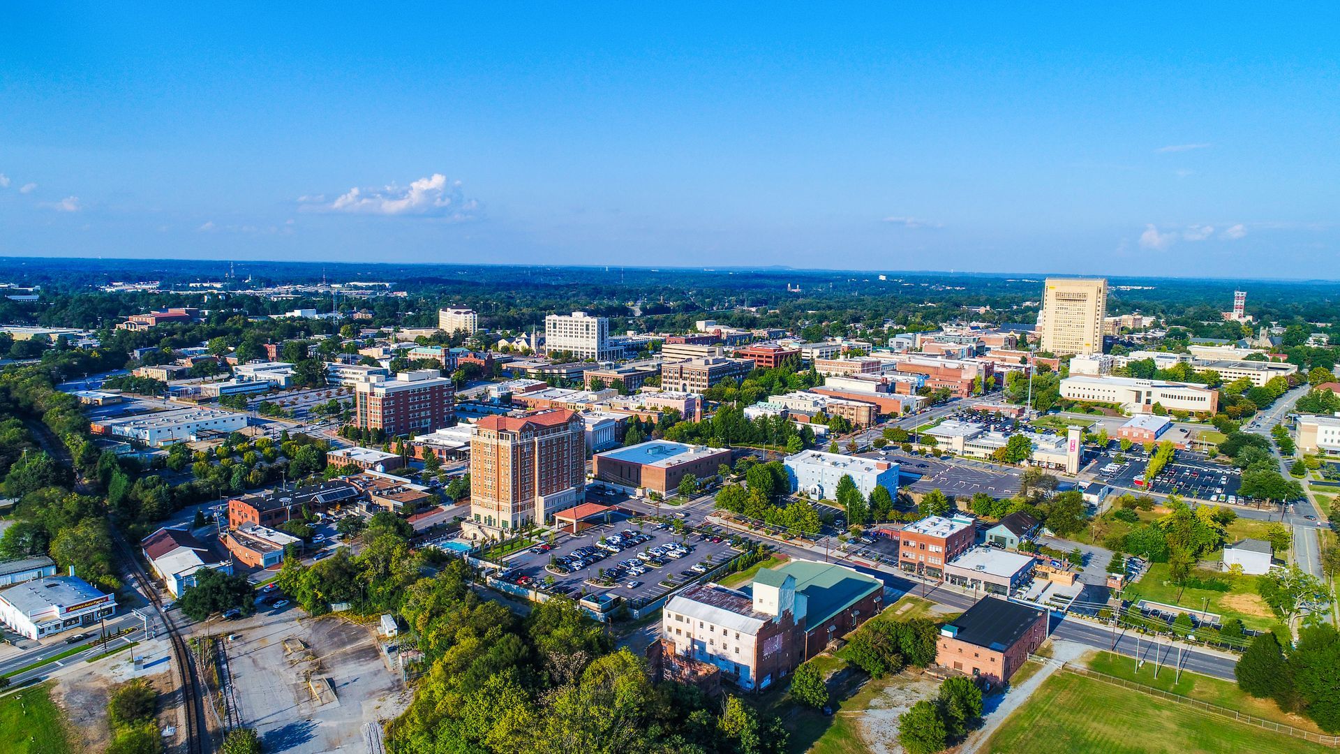 An Aerial View of A City with Lots of Buildings and Trees — Charleston, SC — Charleston Glass Co