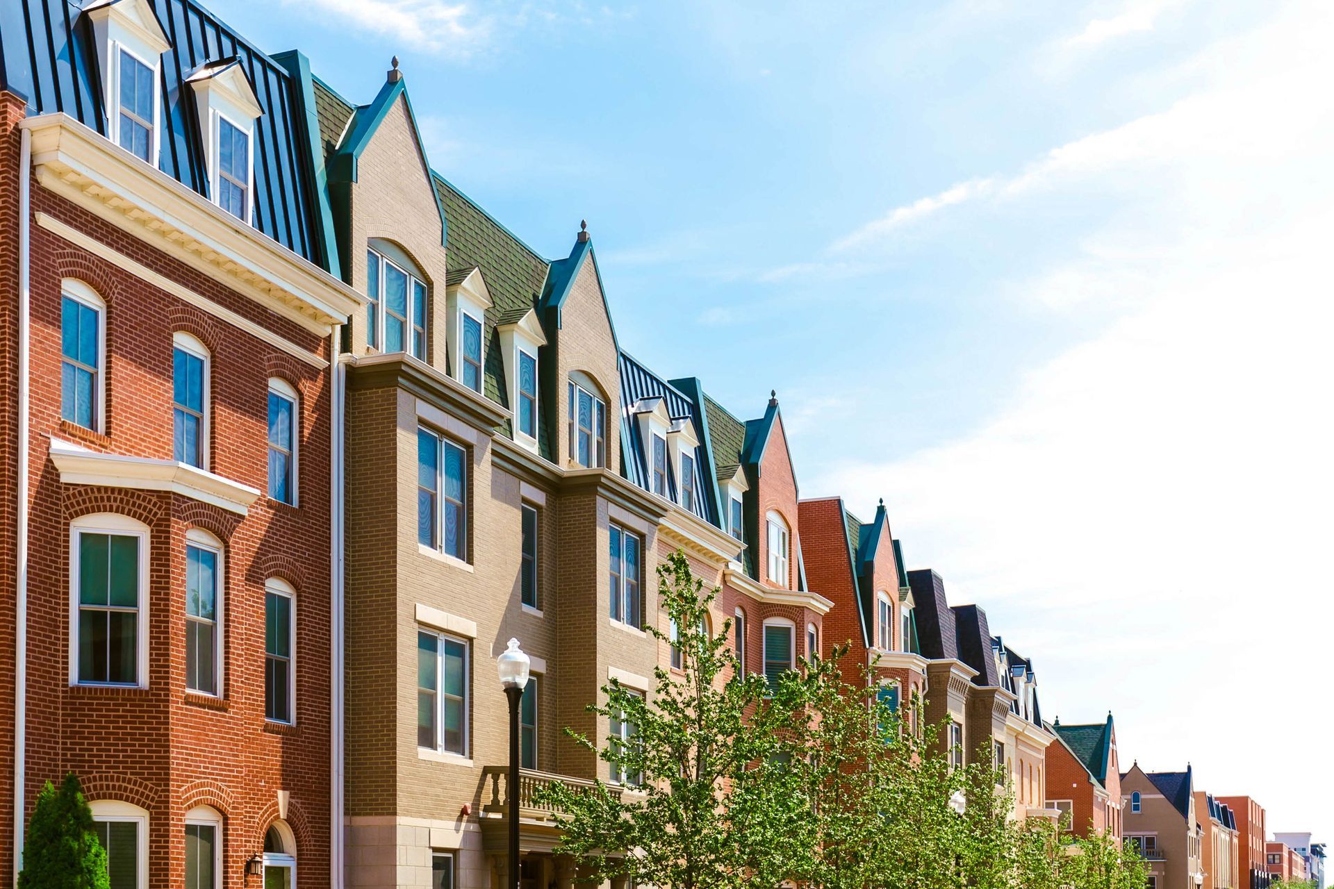 A Row of Brick Apartment Buildings with Green Roofs — Charleston, SC — Charleston Glass Co